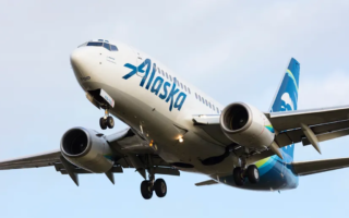 Woman climbs out of Alaska Airlines plane, climbs onto the wing because of anxiety