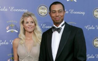 Tiger Woods and ex-wife Elin Nordegren hug after a golf match.