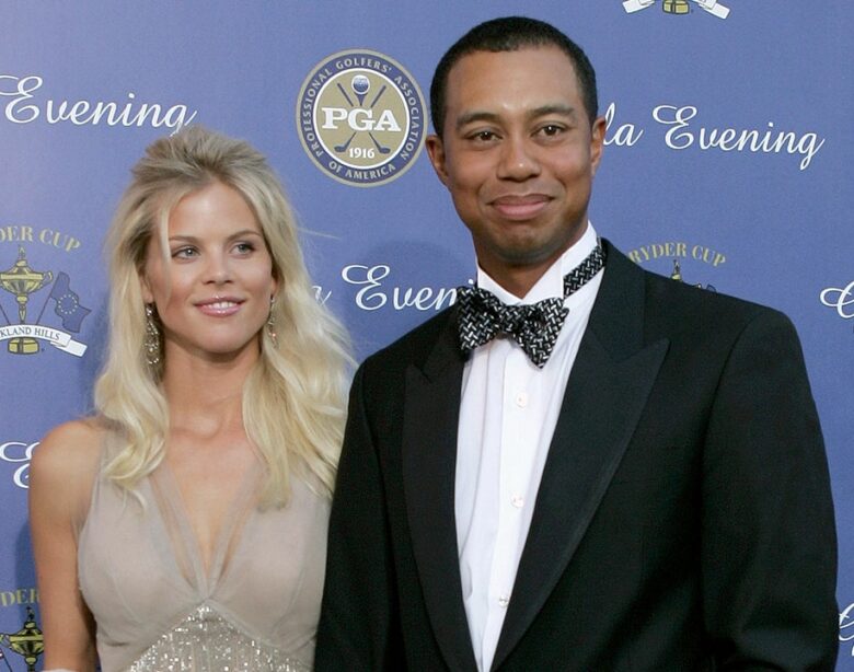 Tiger Woods and ex-wife Elin Nordegren hug after a golf match.