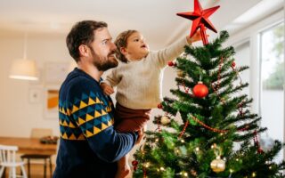 before decorating The Christmas tree is covered with edible decorations such as apples.